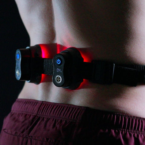 MOVE+ Pro device with LED and laser technology, worn around the waist, designed for pain relief and muscle recovery.