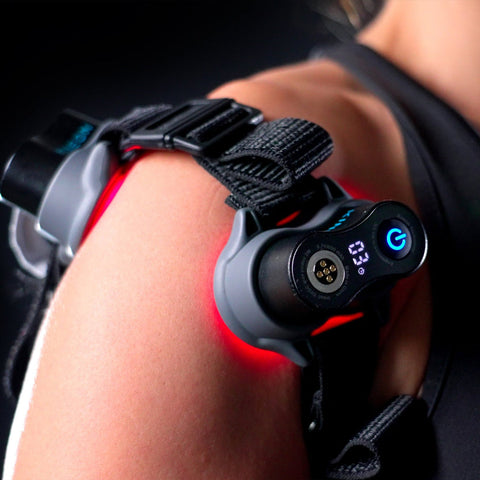 MOVE+ Pro device on a shoulder, with LED and laser technology for pain relief and muscle recovery.