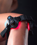 MOVE+ Pro device applied to a knee, with LED and laser technology for pain relief and muscle recovery.